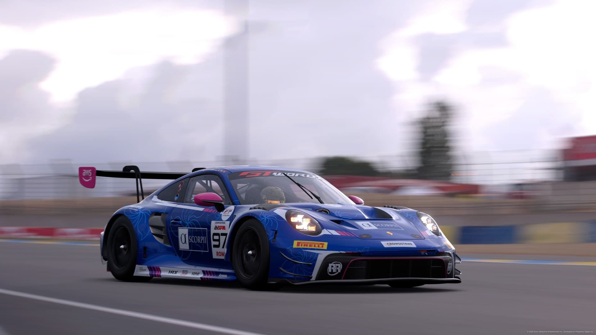 Blue GT race car accelerating on a circuit